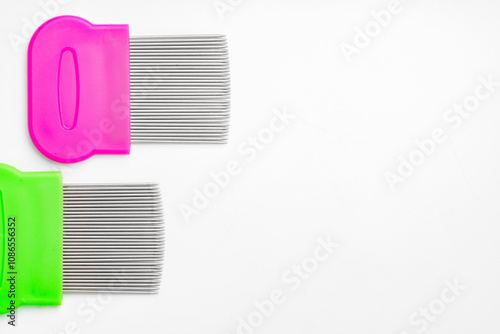 Colorful plastic and metal combs on a white background photo