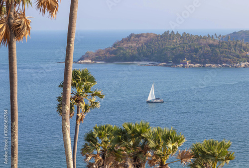 white sailboat sailing in andaman sea at laem phrom thep on holiday in the andaman sea , Phuket , Thailand photo