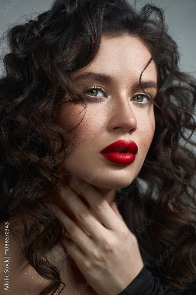 woman with beautiful curly hair poses elegantly, accentuating her striking features with bold red lips in a soft-lit environment, creating an enchanting atmosphere woman with beautiful curly hair poses elegantly, accentuating her striking features with bold red lips in a soft-lit environment, creating an enchanting atmosphere