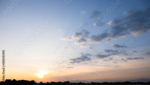 Fototapeta Naklejka Na Ścianę i Meble -  Beautiful sky and cloud at high. Landscape include space, light of nature, sunset, sunrise, horizon or skyline. Colorful with yellow, orange and blue at evening in autumn for background and wallpaper.
