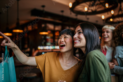 Group of multiracial female friends enter venue after a shopping photo