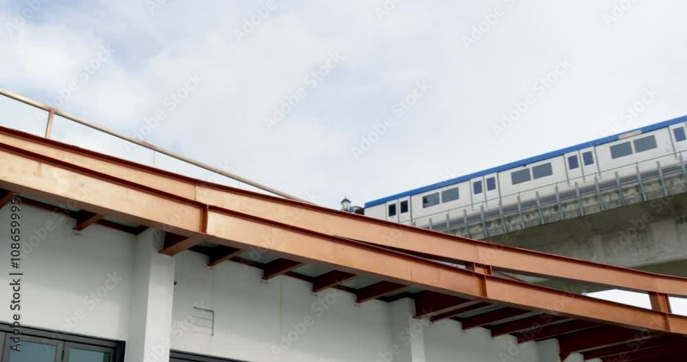 Electric train crossing a river bridge in Bangkok, part of the city's efficient urban transport system. The train is heading toward the station. Electric train crossing a river bridge in Bangkok, part of the city's efficient urban transport system. The train is heading toward the station.