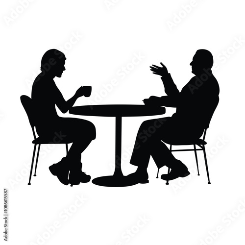 Two people sitting at a table. One of them is holding a cup. The table is round