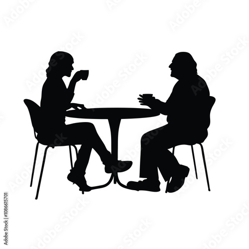 Two people sitting at a table. One of them is holding a cup. The table is round