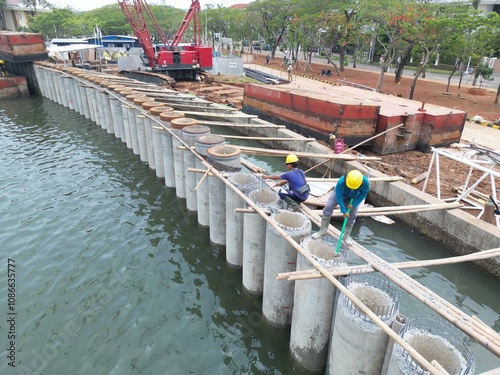 construction and landscaping projects A giant sea wall to proteck Jakarta from sea flood photo