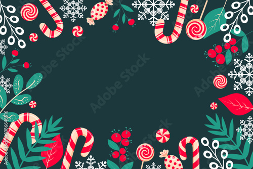 Christmas background with candy cane, lollipop, candy, twigs, berries and snowflakes on dark green background. Copy space. Decorative Christmas border.