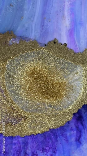 Creating beautiful alcohol ink abstract art with gold shimmer on canvas outdoors