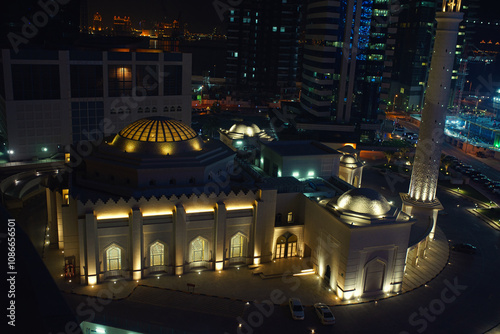 Ibrahim Khalil Al-Darwish Mosque surrounded by skyscrappers on the hot night