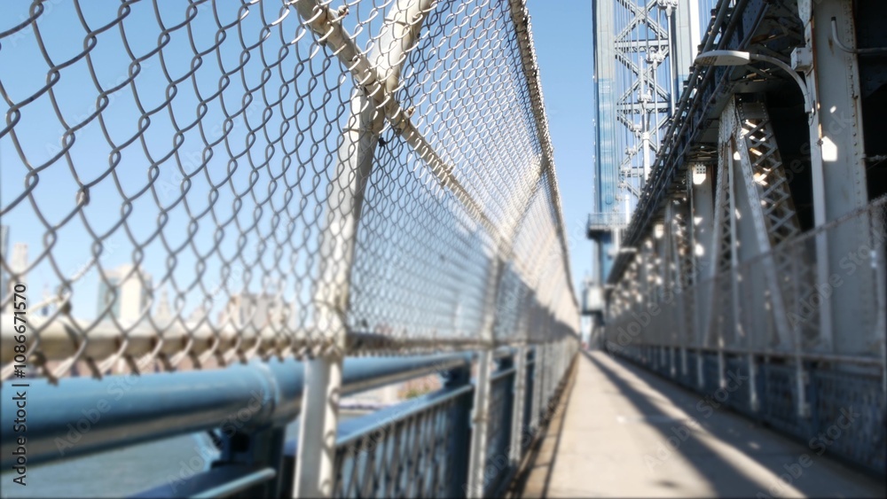 Obraz premium New York City Manhattan Bridge to Brooklyn Dumbo. USA travel destination. Architecture of United States, tourist landmark. Cable-stayed bridge. Pedestrian path perspective. Downtown skyline cityscape.