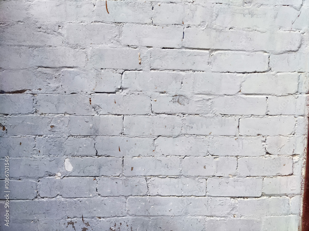 Fototapeta premium The weathered gray brick wall features a smooth texture with ample space for adding text, making it suitable for various design applications