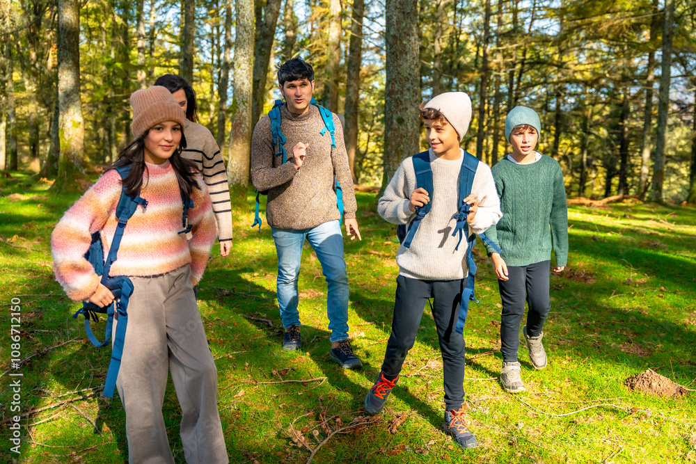 Fototapeta premium Family enjoying hiking together in the forest
