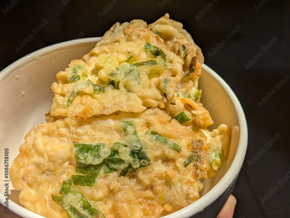 Fried tempe Mendoan inside of the bowl, Traditional food from Indonesia made of beans. Fried tempe Mendoan inside of the bowl, Traditional food from Indonesia made of beans.