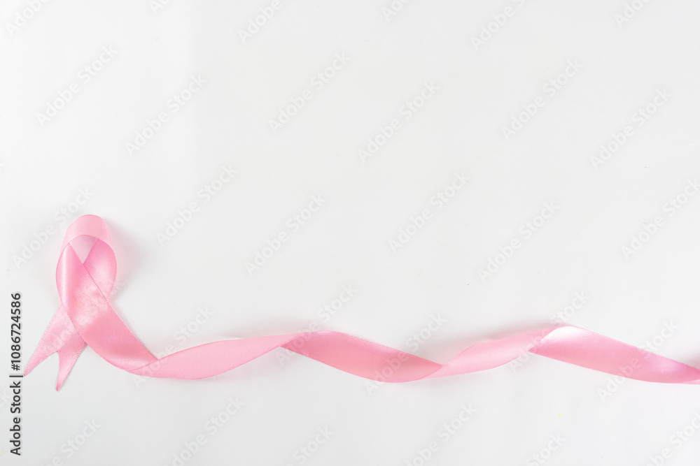 Pink ribbon on white background. A Symbol of Breast cancer awareness, cancer awareness month. Pink ribbon on white background. A Symbol of Breast cancer awareness, cancer awareness month.