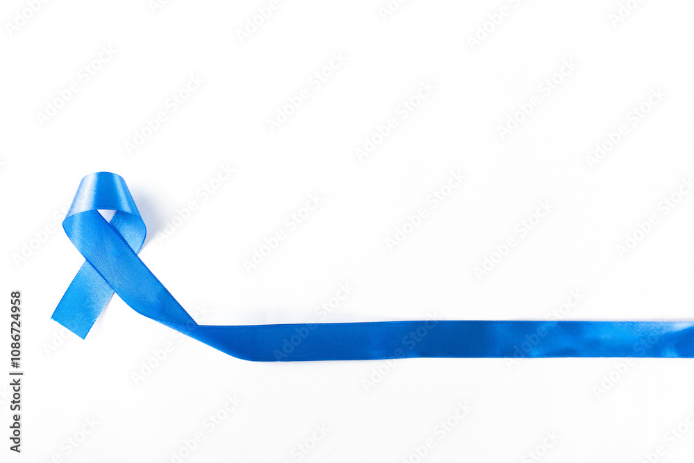 Blue ribbon isolated on white and top view. A Symbol of Prostate cancer awareness. cancer awareness month concept. Blue ribbon isolated on white and top view. A Symbol of Prostate cancer awareness. cancer awareness month concept.