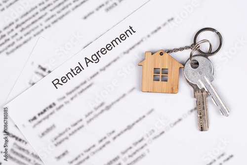 Rental or Residential Lease agreement contract and house keys. Short and long term rentals, housing searching crisis, signing lease agreement, and rising prices.