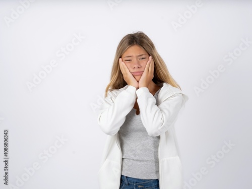 Beautiful teen girl wearing white jacket Tired hands covering face, depression and sadness, upset and irritated for problem