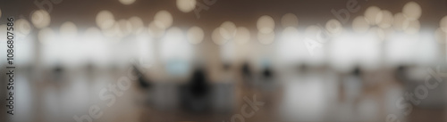 Blurred empty open space office. Abstract light bokeh at office interior background for design