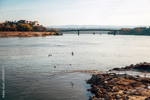 Canvas Print Petrovaradin fortress over Danube river with sewage outflow