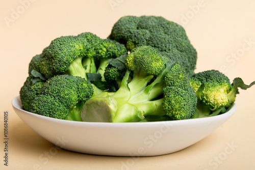 broccoli of fresh green broccoli in bowl over coloredbackground. , close up. Fresh vegetable photo