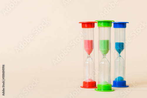 hourglass on the table, sand clock as time passing concept for business deadline, copy space