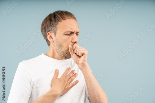 Tablou pe pânză Unwell man struggles with persistent coughing, holding chest by sharp pain