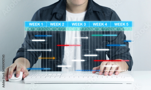 Personnel development plans and preparation of action plans. Businessmen display virtual screens to manage work projects and update work progress with schedule to achieve success efficiently.