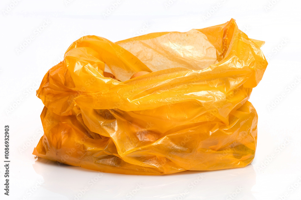 Bio organic trash sorted in yellow plastic bag for composting or recycling isolated on white background. Bio organic trash sorted in yellow plastic bag for composting or recycling isolated on white background.