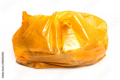 Bio organic trash sorted in yellow plastic bag for composting or recycling isolated on white background. 