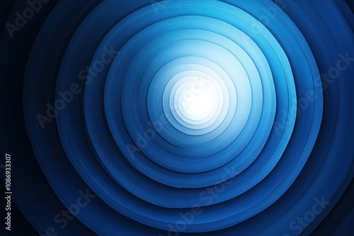 Abstract blue concentric circles converging towards a bright white center