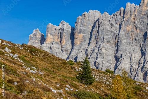 Monte Civetta in the Dolomites is a prominent mountain known for its vertical rock walls and alpine beauty. Ideal for photography, it features rugged peaks, dramatic cliffs, and scenic natural landsca photo