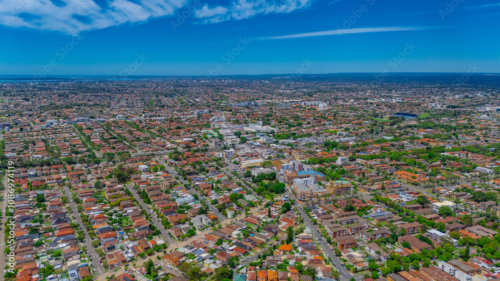 Panoramic aerial drone view of western Sydney Suburbs of Canterbury Burwood Ashfield Marrickville Campsie with Houses roads and parks in Sydney New South Wales NSW Australia Panoramic aerial drone view of western Sydney Suburbs of Canterbury Burwood Ashfield Marrickville Campsie with Houses roads and parks in Sydney New South Wales NSW Australia