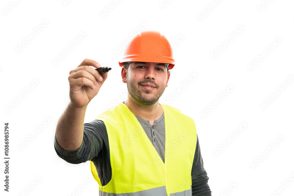 Workman wearing helmet and vest writing on copyspace Workman wearing helmet and vest writing on copyspace