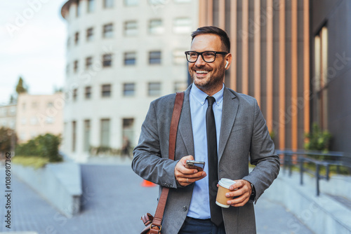 Businessman Smiling Outside Modern Office Building With Coffee