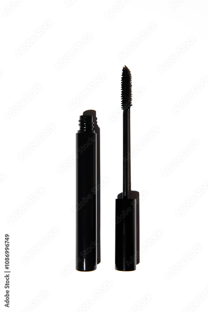 Close-up of empty black mascara and brush mockup on bright white background. Striking contrast of bold beauty and floral freshness, perfect for makeup, cosmetics Close-up of empty black mascara and brush mockup on bright white background. Striking contrast of bold beauty and floral freshness, perfect for makeup, cosmetics