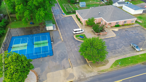 Tennis court in residential neighborhood near historic downtown Checotah, McIntosh County, Oklahoma, Midwest small town USA landscape, agriculture town, aerial view photo