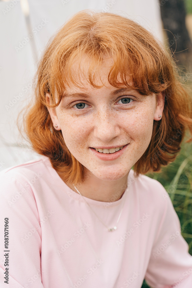 Portrait of a girl with red hair outdoors Portrait of a girl with red hair outdoors