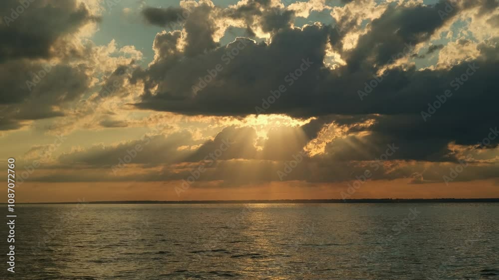 Wonderful sunset by the sea with smooth waves and beautiful sky. Summer background. Vacation concept. Wonderful sunset by the sea with smooth waves and beautiful sky. Summer background. Vacation concept.