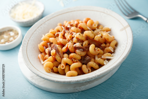 Pasta with tomato sauce and smoked ham