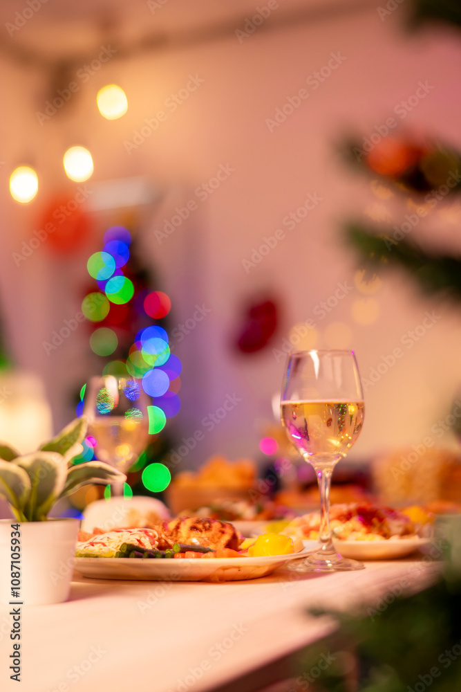 A table with a variety of food and drinks, including a glass of wine A table with a variety of food and drinks, including a glass of wine