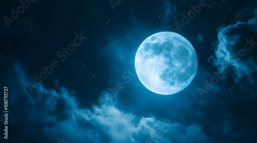 Full moon illuminates dark night sky through wispy clouds creating ethereal celestial scene, copy space