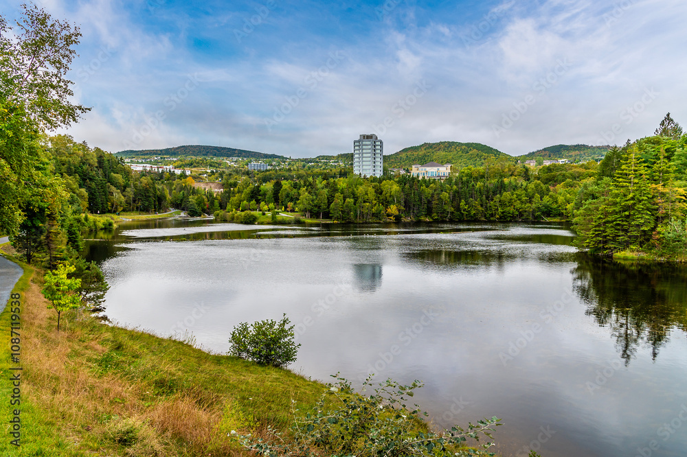 A view along the length of the Glynmill pond on the Corner Brook Stream Trail at Corner Brook in Newfoundland, Canada in the fall A view along the length of the Glynmill pond on the Corner Brook Stream Trail at Corner Brook in Newfoundland, Canada in the fall