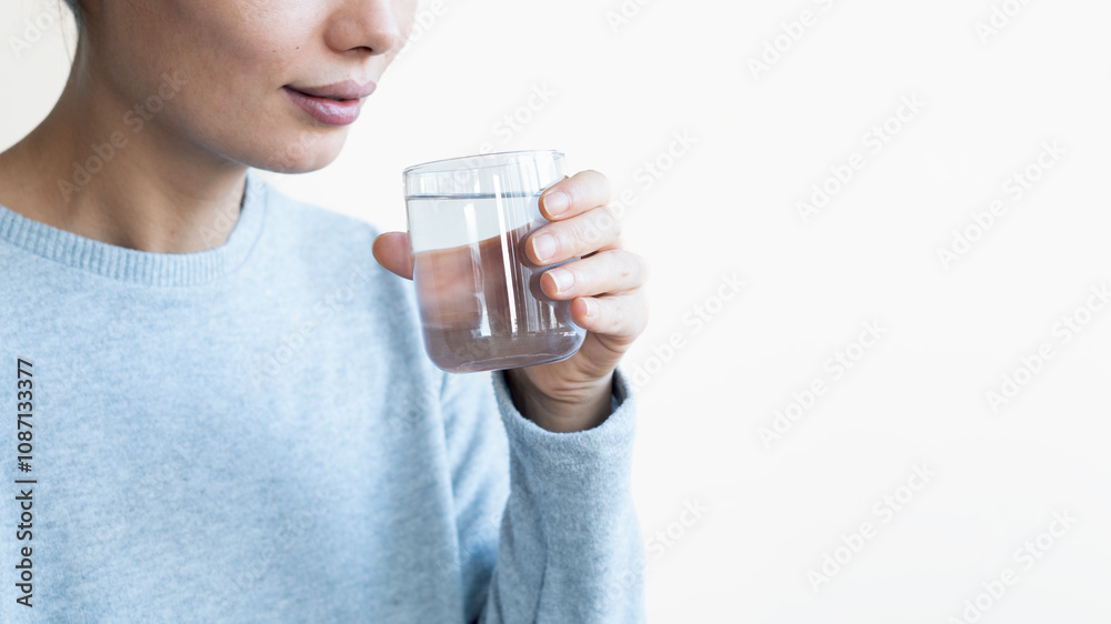 Water concept, Woman Drinking Water on white background Water concept, Woman Drinking Water on white background