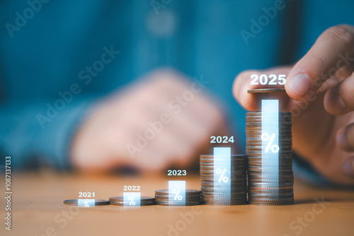 Businessman putting coin with 2025 to coins stack percentage and bar graph for save money for investment growth in 2025 concept.
