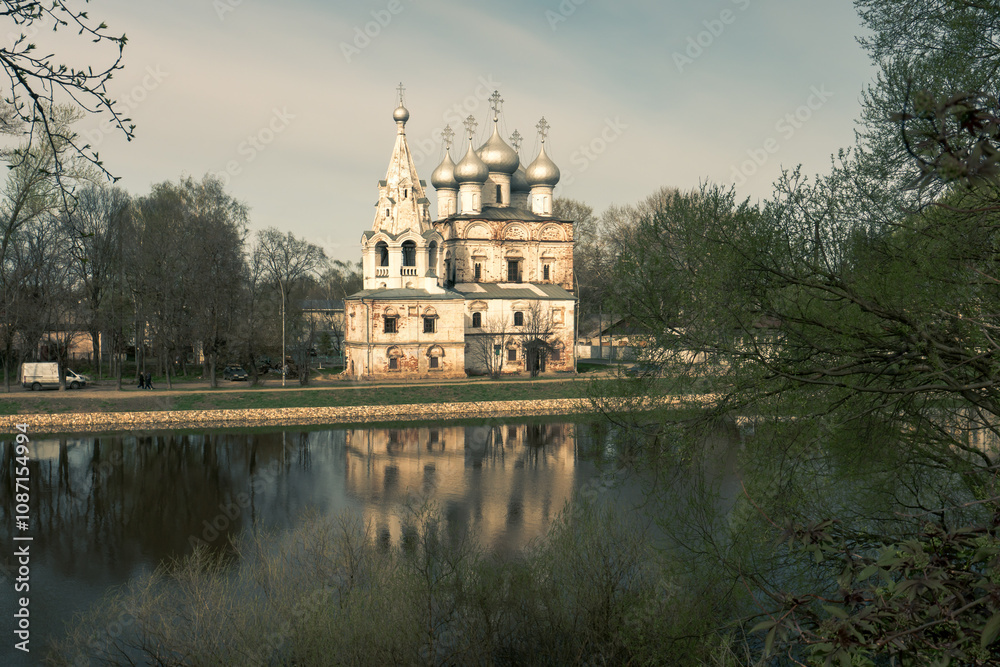 Vologda River embankment lined with low historical buildings and churches Vologda River embankment lined with low historical buildings and churches