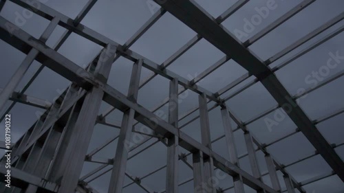 Pan shot to top of construction knockdown housing from steel