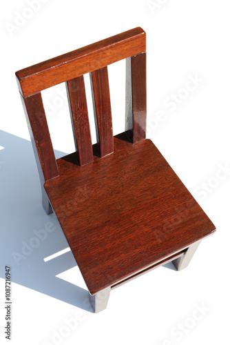 Small mahogany chair on a white background