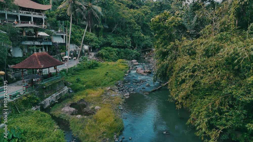 A serene river flowing through a lush tropical landscape, captured in cinematic 4K quality. A serene river flowing through a lush tropical landscape, captured in cinematic 4K quality.
