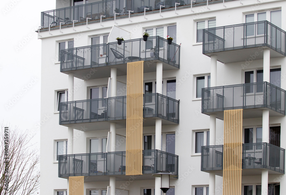 Multi-family apartment block with lots of windows