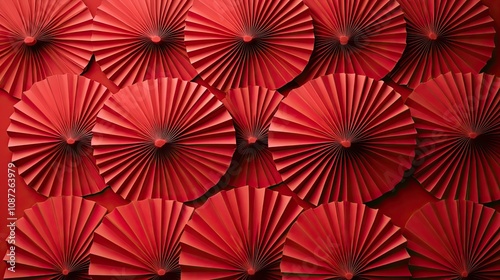 Intricate folded fan patterns in shades of red, forming a traditional Chinese-inspired texture ideal for backgrounds