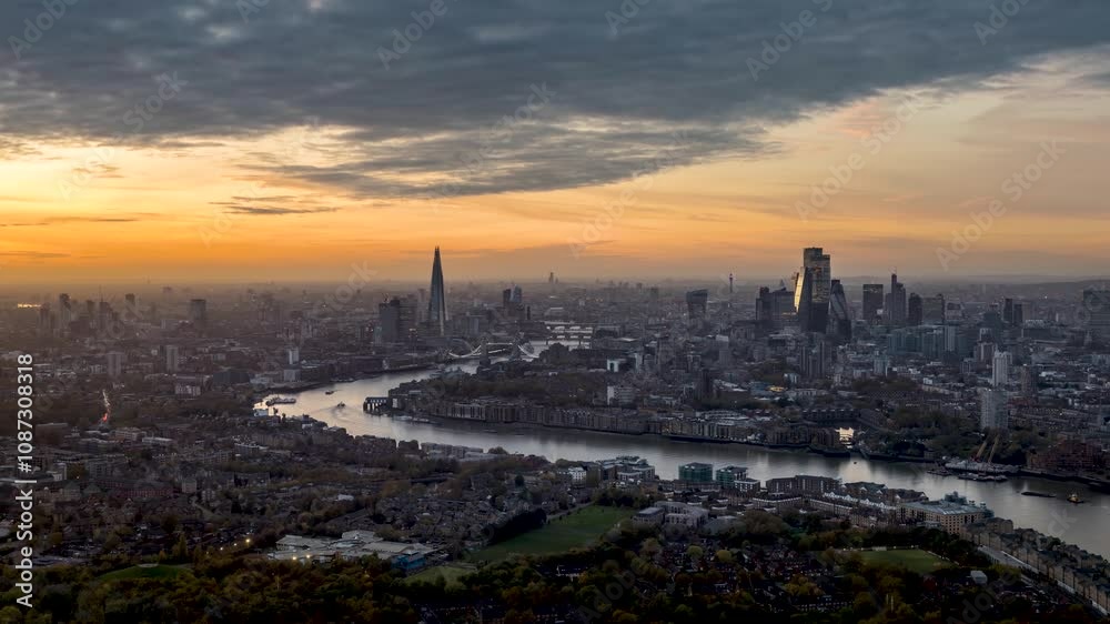 Sunset to night time lapse view of the urban cityscape of London, England, with beautiful clouds and sunlight